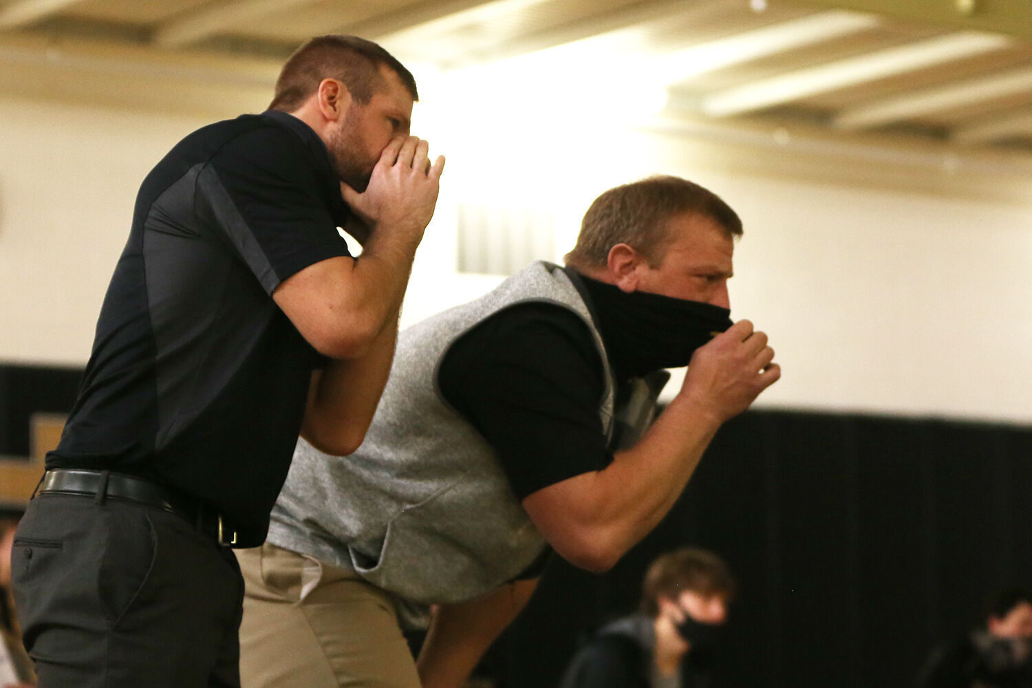 Garrett Traylor, left, and assistant coach Jason Tomich yell